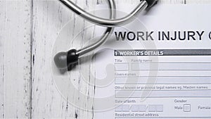 Work injury claim form with a stethoscope