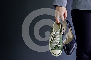 Work Life Balance Concept, present by Business Working Woman holding a High Heal and Sneaker Shoes, Croped image with Copy Space