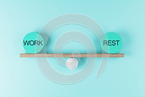 Work life balance concept with scales from wooden board on a ball and equal weight plates with words work and rest