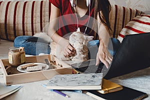 Work-life balance, Home office, work space, work from home, Flexible work hours concept. Young woman with laptop and cat