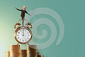 Work Life Balance for Time and Money Concept. Excited Businessman Balancing his body on Vintage Alarm Clock and Stack of Coin. Fa