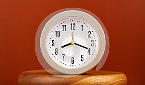 work in daily life Photo of a modern clock in a high quality photo studio