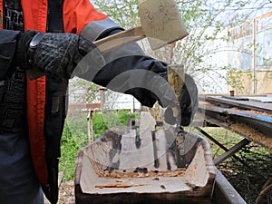 Work with a mallet and a chisel on wood