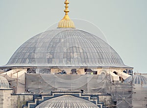 Persons work in Blue Mosque in restoration