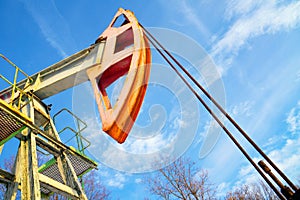 Work of oil pump jack on a oil field in desert