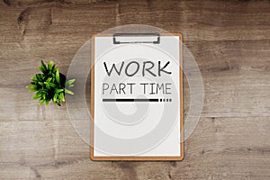 WORK PART TIME text on white paper on clipboard