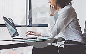 Work Process in Modern Office. Young Woman Account Manager Working at Wood Table with New Business Project. Typing