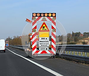 Work in progess in the italian road the text meas Reduce Speed photo