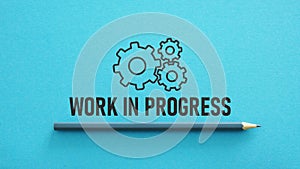 Work in progress is shown using the text and picture of gears