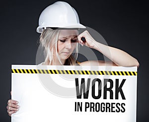 Work in progress sign on information board, thinking worker