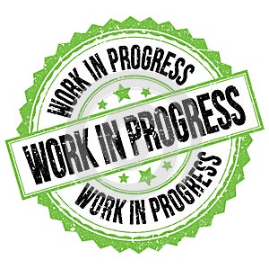 WORK IN PROGRESS text on green-black round stamp sign