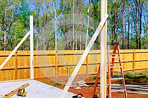 Work in progress view of new unfinished house with wooden beams