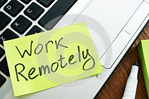 Work Remotely memo stick. Laptop for remote job