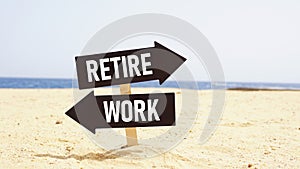 Work or Retire signpost in a sea beach background. Two way street road sign pointing to Work and Retire