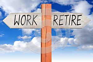 Work or retire - wooden signpost