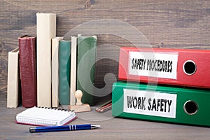 Work Safety and Safety Procedures. Binders on desk in the office. Business background