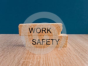 Work Safety symbol. Concept words ' Work Safety ' on brick blocks on a beautiful dark blue backgrounds.
