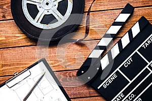 Work screenwriter on wooden background top view