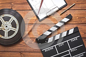 Work screenwriter on wooden background top view