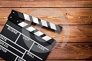 Work screenwriter on wooden background top view