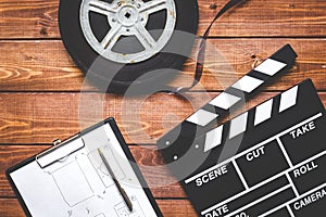 Work screenwriter on wooden background top view