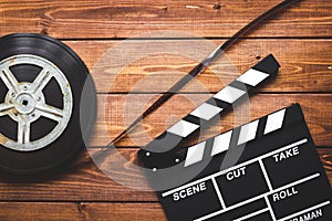 Work screenwriter on wooden background top view