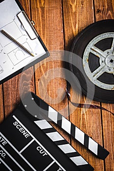 Work screenwriter on wooden background top view photo