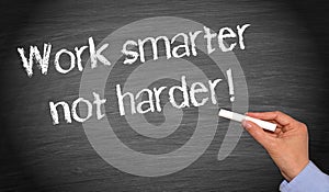Work smarter not harder - female hand writing text