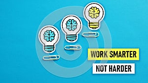 Work Smarter Not Harder is shown using the text and picture of lamps photo