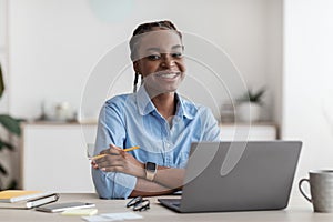 Work For Students. Black Young Female Office Employee Posing At Workplace