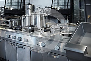 Work surface and kitchen equipment in professional kitchen, view counter in stainless steel