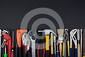 Work tools on black background.