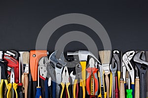 Work tools on black background.