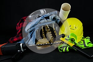 Work tools for construction worker  on black background.