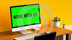 Work with us written on a memo at the office.