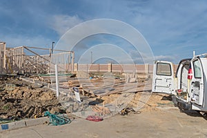 Work van with back open and tools at construction site