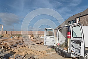 Work van with back open and tools at construction site