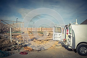 Work van with back open and tools at construction site