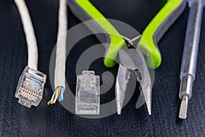 Work in a workshop on connections used in electronics. Computer cables and connectors rj44