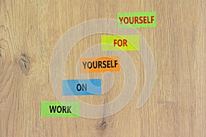 Work for yourself symbol. Concept words Work on yourself for yourself on colored paper. Beautiful wooden table wooden background.