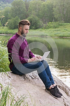 Workaholic man working on laptop, remote work. Freelancer. teleworking