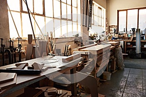 Workbenches inside of a large woodworking shop