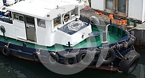 Workboat docked in the harbor