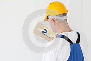 Worker aligns with sandpaper