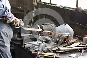 Worker with angle grinder