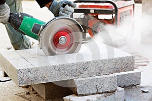 Worker with angle grinder