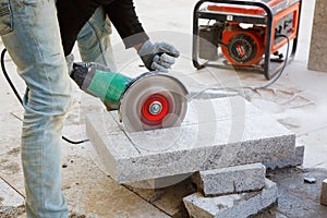 Worker with angle grinder