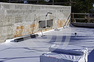 Worker on application Synthetic waterproofing PVC-P and TPO / FPO
