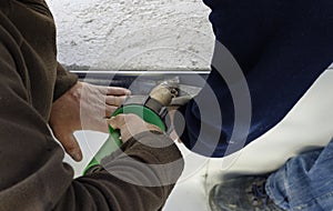 Worker on application Synthetic waterproofing PVC-P and TPO / FPO