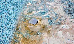 Worker applies waterproofing with a small brush photo